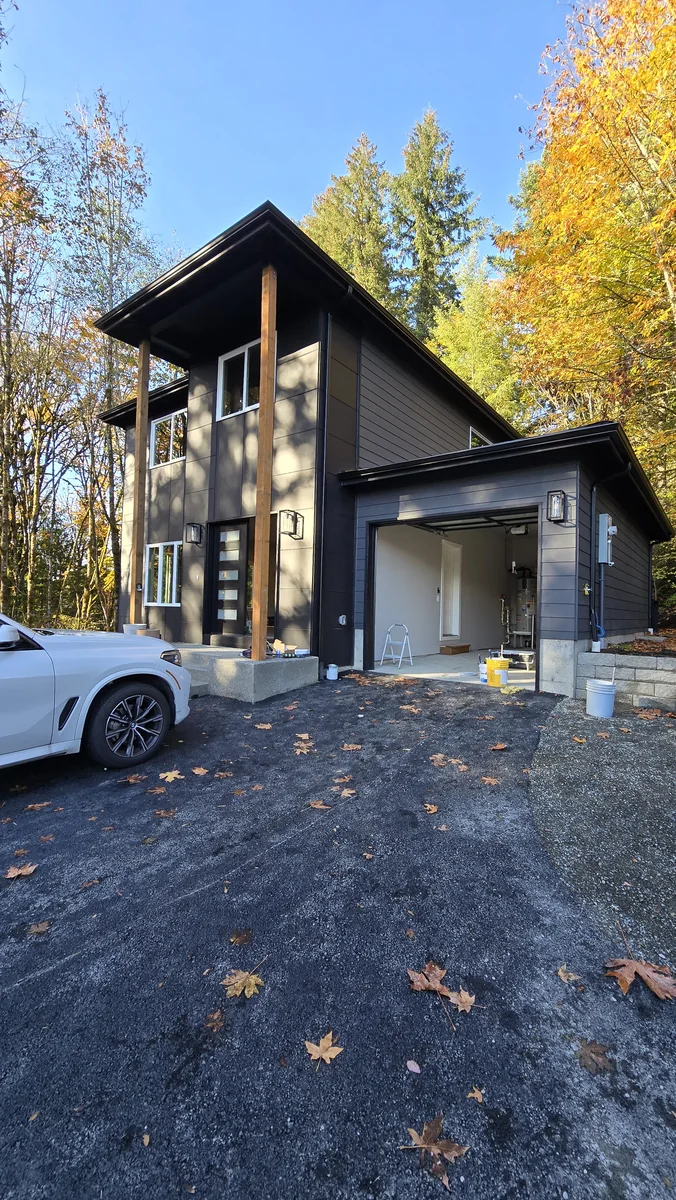 Dark exterior entry and siding finish