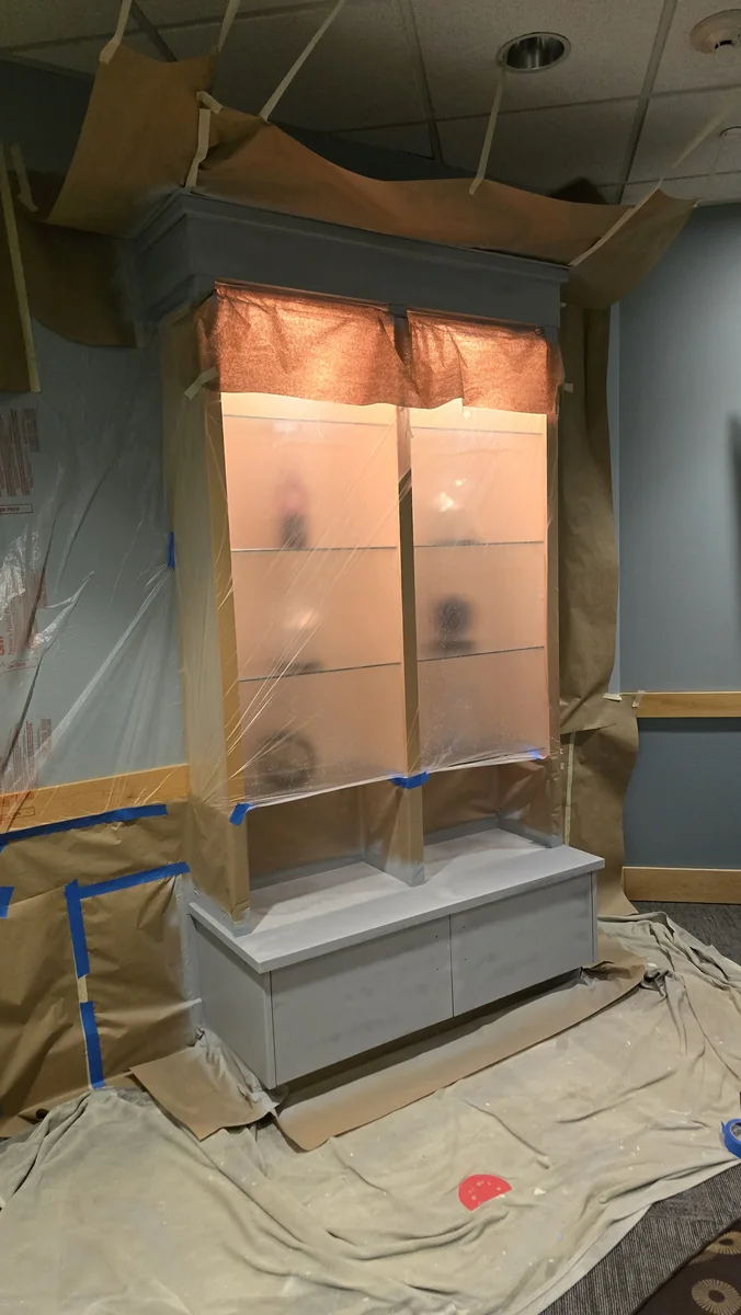 Protected mantel and fireplace detail during prep