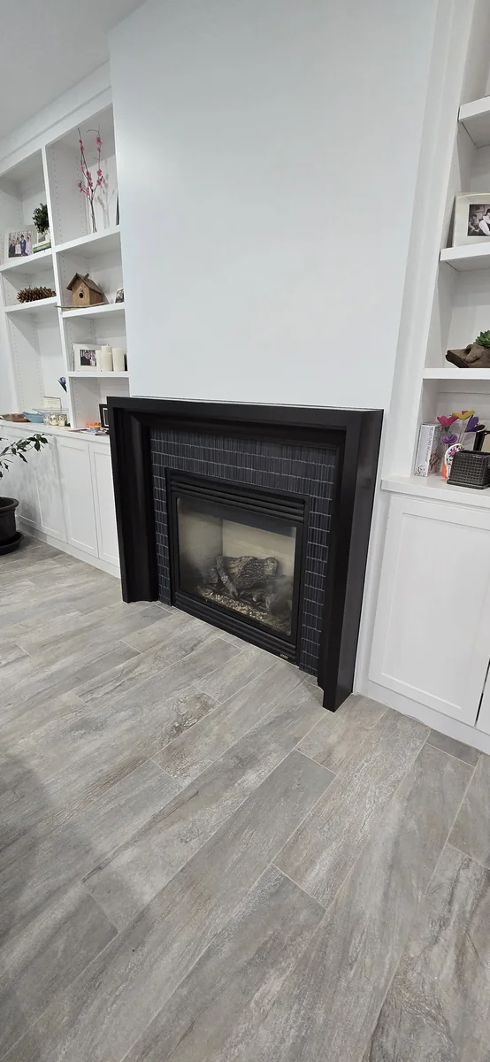 Finished fireplace and surrounding trim detail