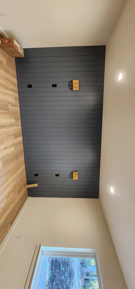 Finished room with dark accent wall